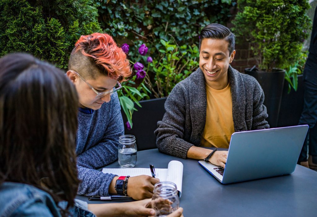 people outside with laptop