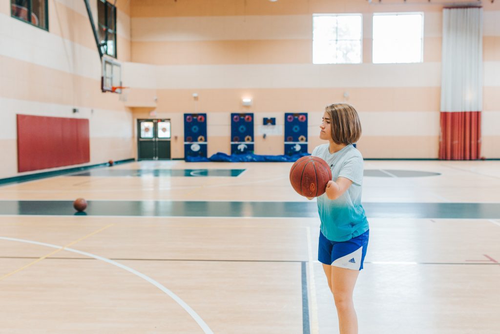 teenager on basketball court