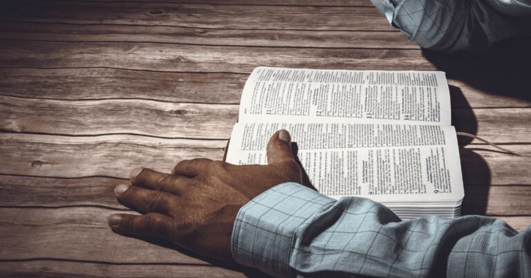 bible and hand