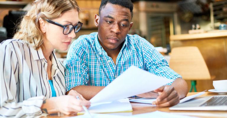 Couple looking at church finances and transparency