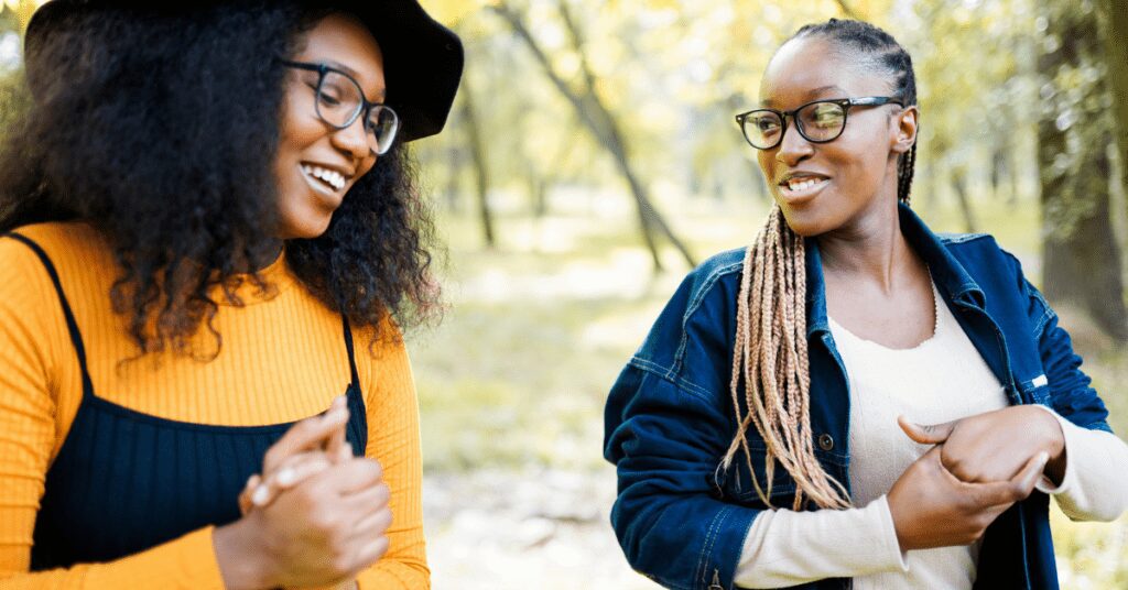 Two women talking outside.