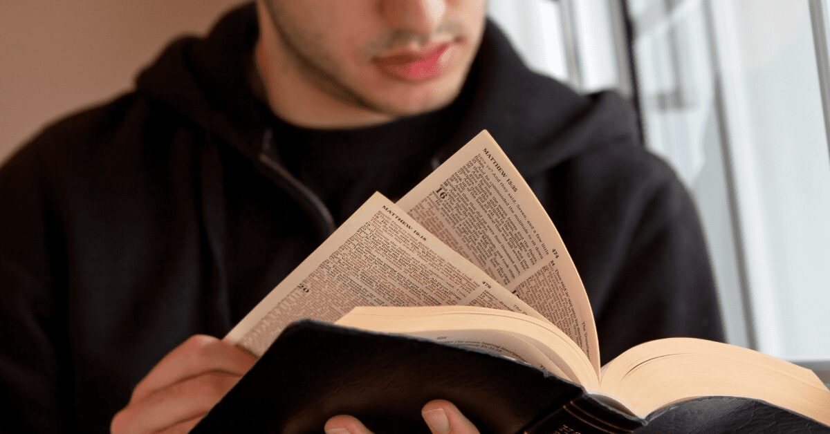 Closeup of man looking at Bible