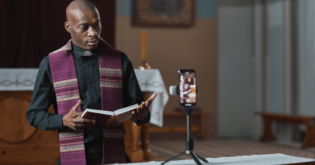 Minister presenting on church via smartphone video.