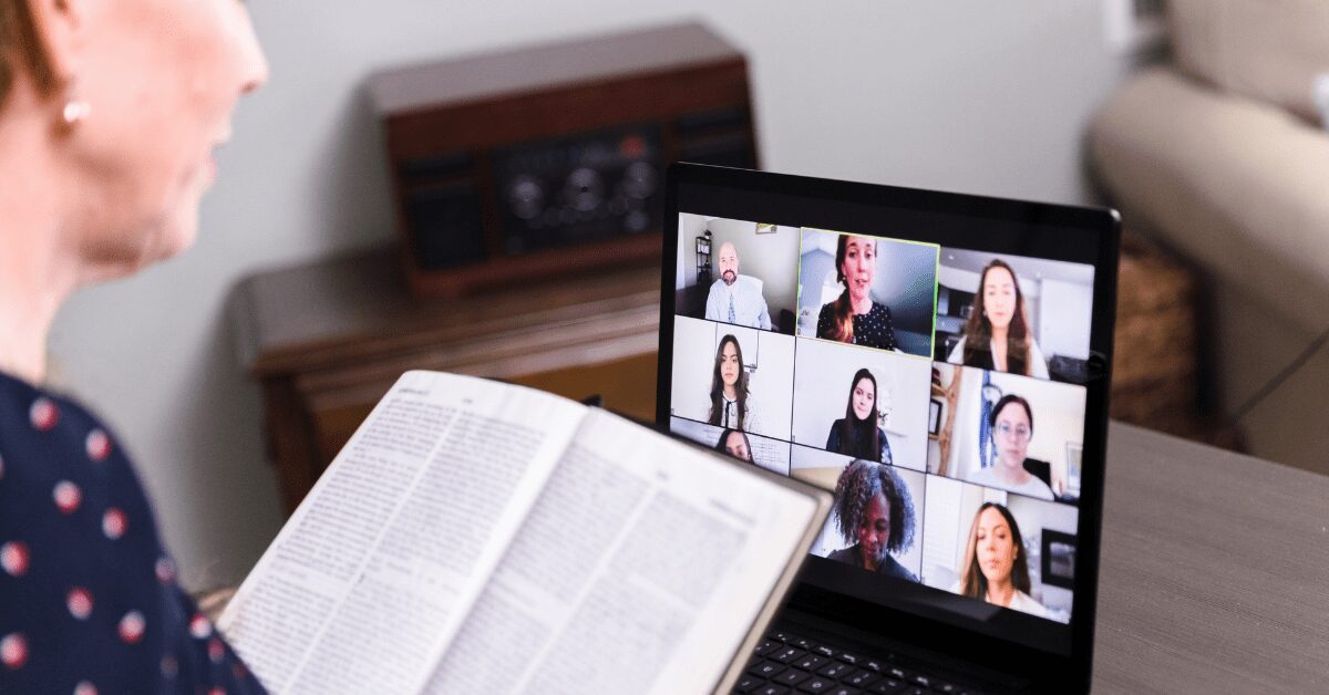 Woman at laptop doing an online Bible study with others over Zoom.