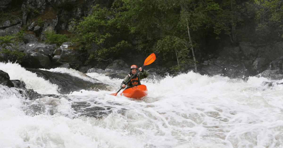 kayaker in turbulent whitewater