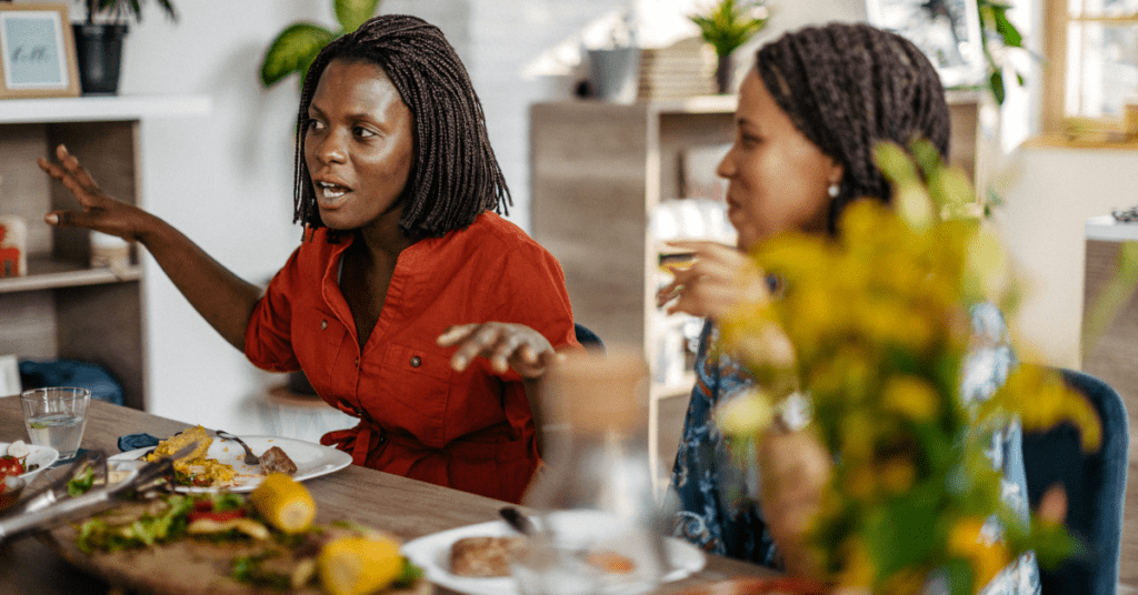 women talking over dinner