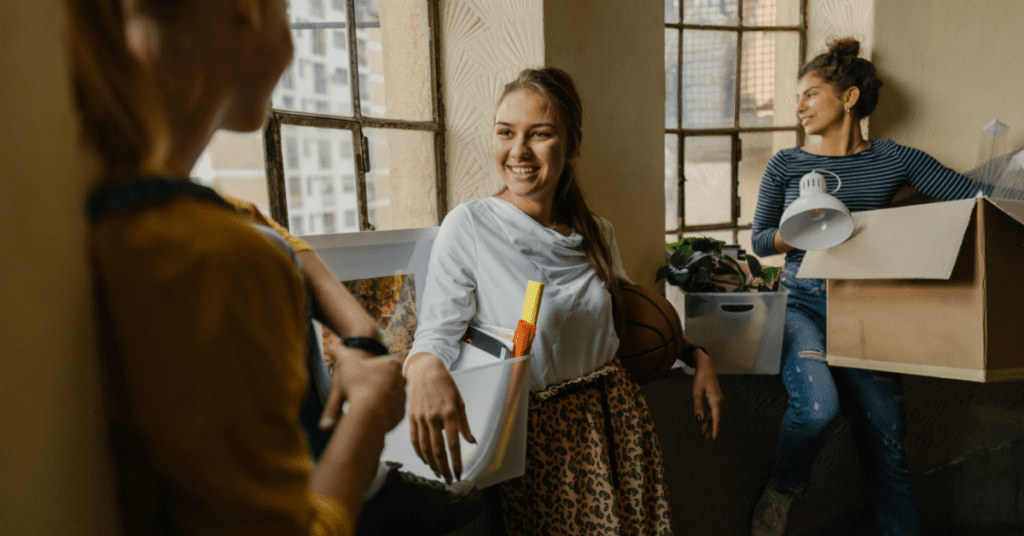 young woman smiling and talking to friends