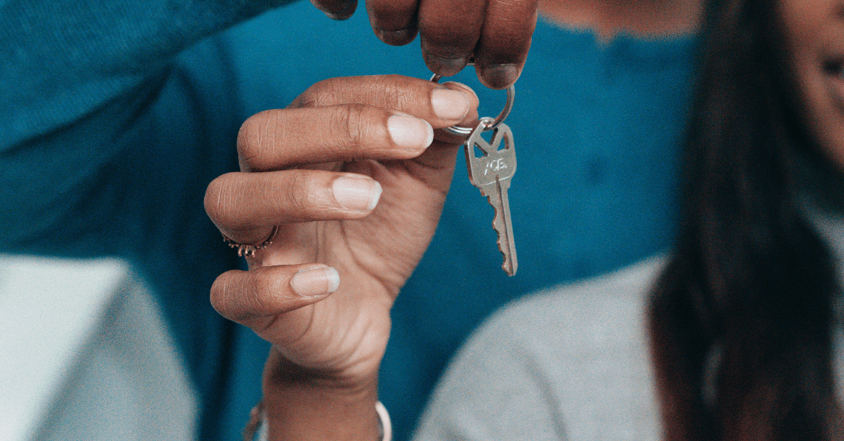 woman holding a key