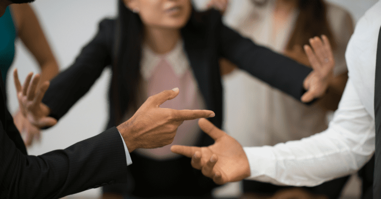 woman separating 2 arguing people