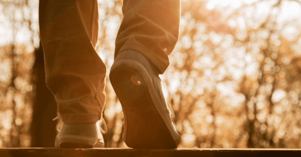 view of shoes as someone walks away