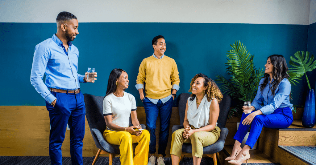 roup of smiling people talking