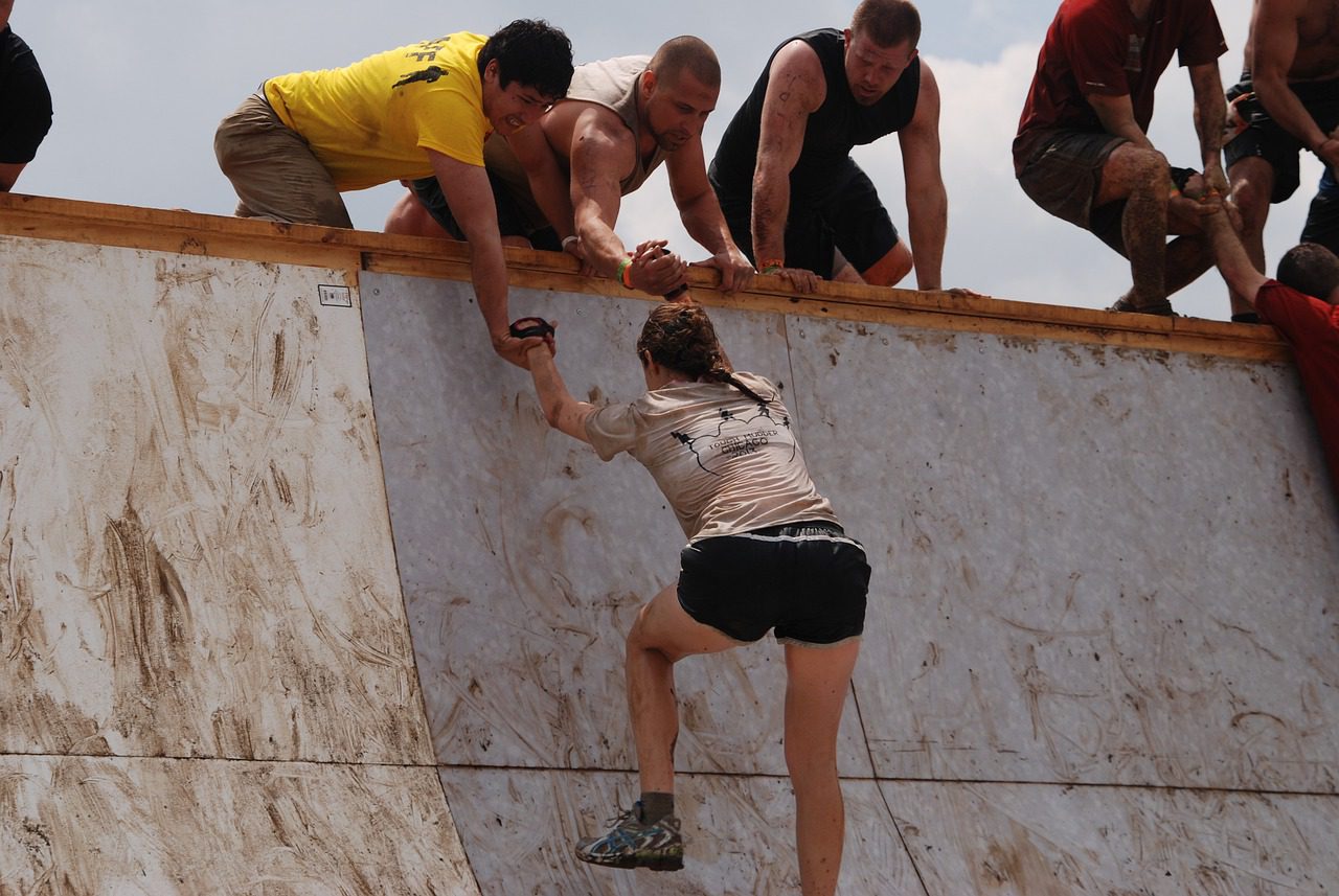 people running a difficult obstacle course
