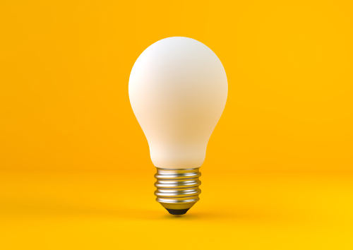 White,Light,Bulb,On,Bright,Yellow,Background,In,Pastel,Colors.