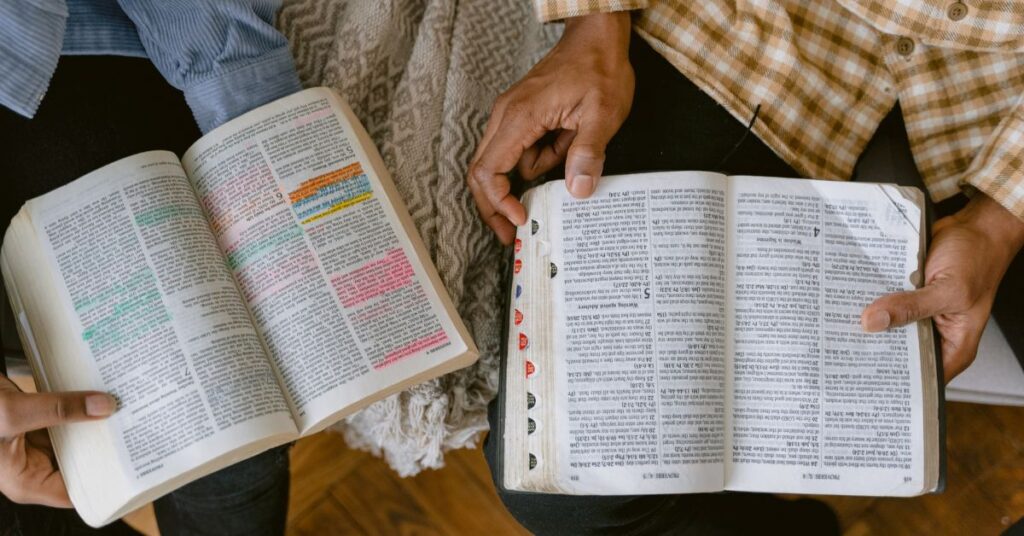 two people reading the bible together
