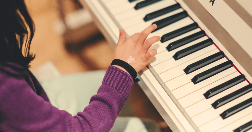 girl playing piano