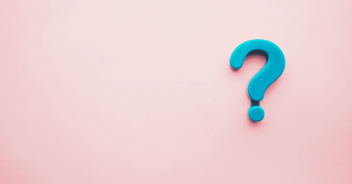 question mark magnet on pink background