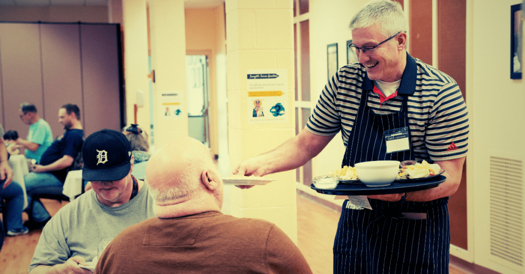 man serving food