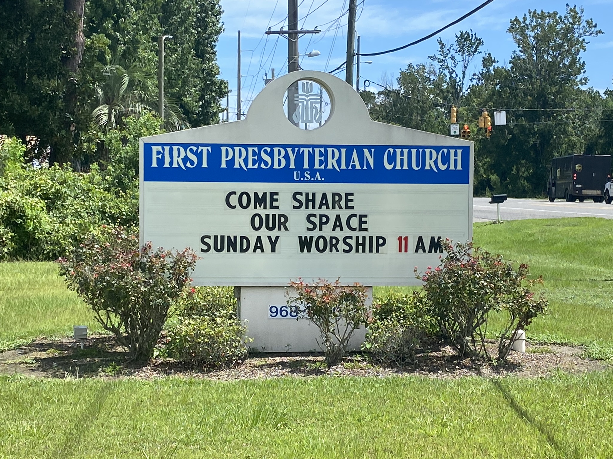 Sign outside of First Presbyterian Church reading: "come share our space" written by the church property management team in order to promote alternative means for building usage.