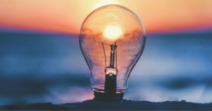 lightbulb in front of a sunset