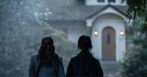 photo of two missionaries in front of a door