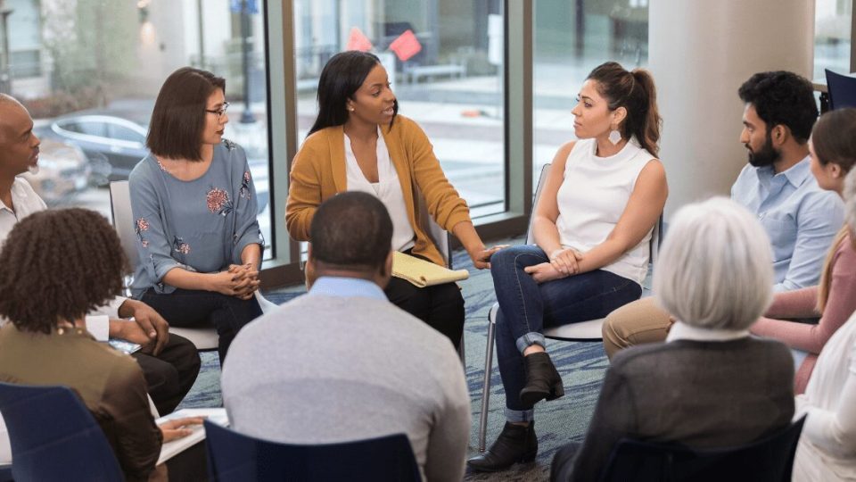 Group in a circle talking.