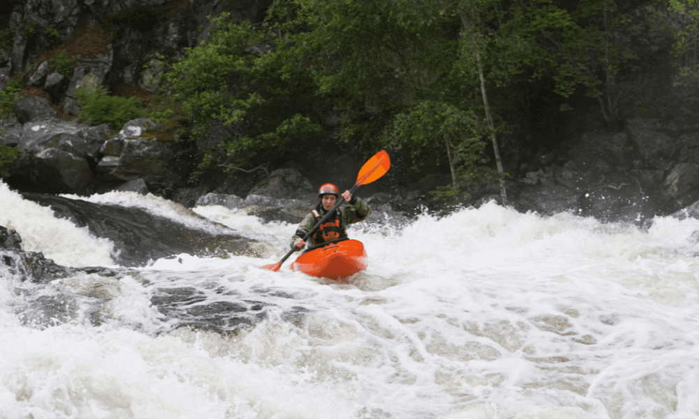 kayaker in turbulent whitewater